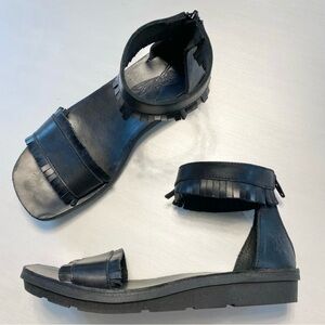 Fly London Mexa Fringe Sandal in Black